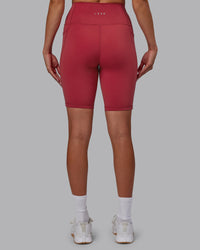 Woman wearing Fusion Ultra High-Rise 9" Short Pockets - Claret | Model:Blaize | Size:S