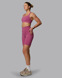 Woman wearing Fusion Ultra High-Rise 9" Short Pockets - Mauve Haze | Model:Chloe | Size:XS