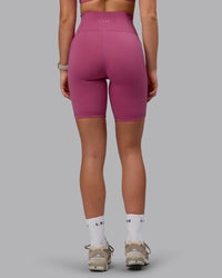 Woman wearing Fusion Ultra High-Rise 9" Short Pockets - Mauve Haze | Model:Chloe | Size:XS