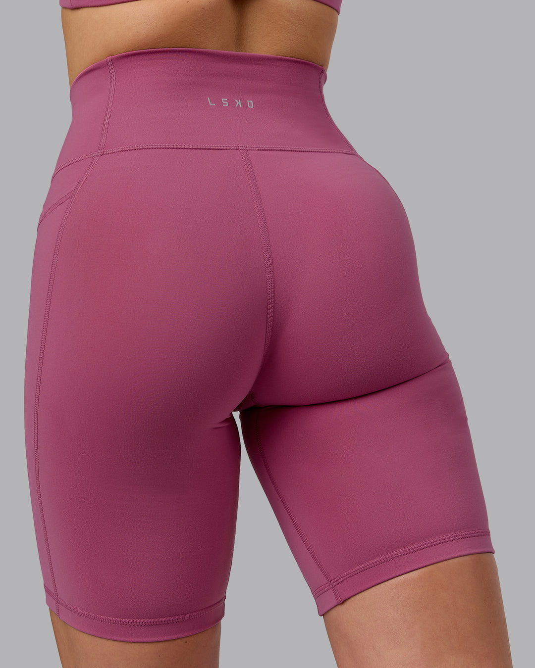 Woman wearing Fusion Ultra High-Rise 9&quot; Short Pockets - Mauve Haze | Model:Chloe | Size:XS