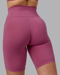Woman wearing Fusion Ultra High-Rise 9" Short Pockets - Mauve Haze | Model:Chloe | Size:XS