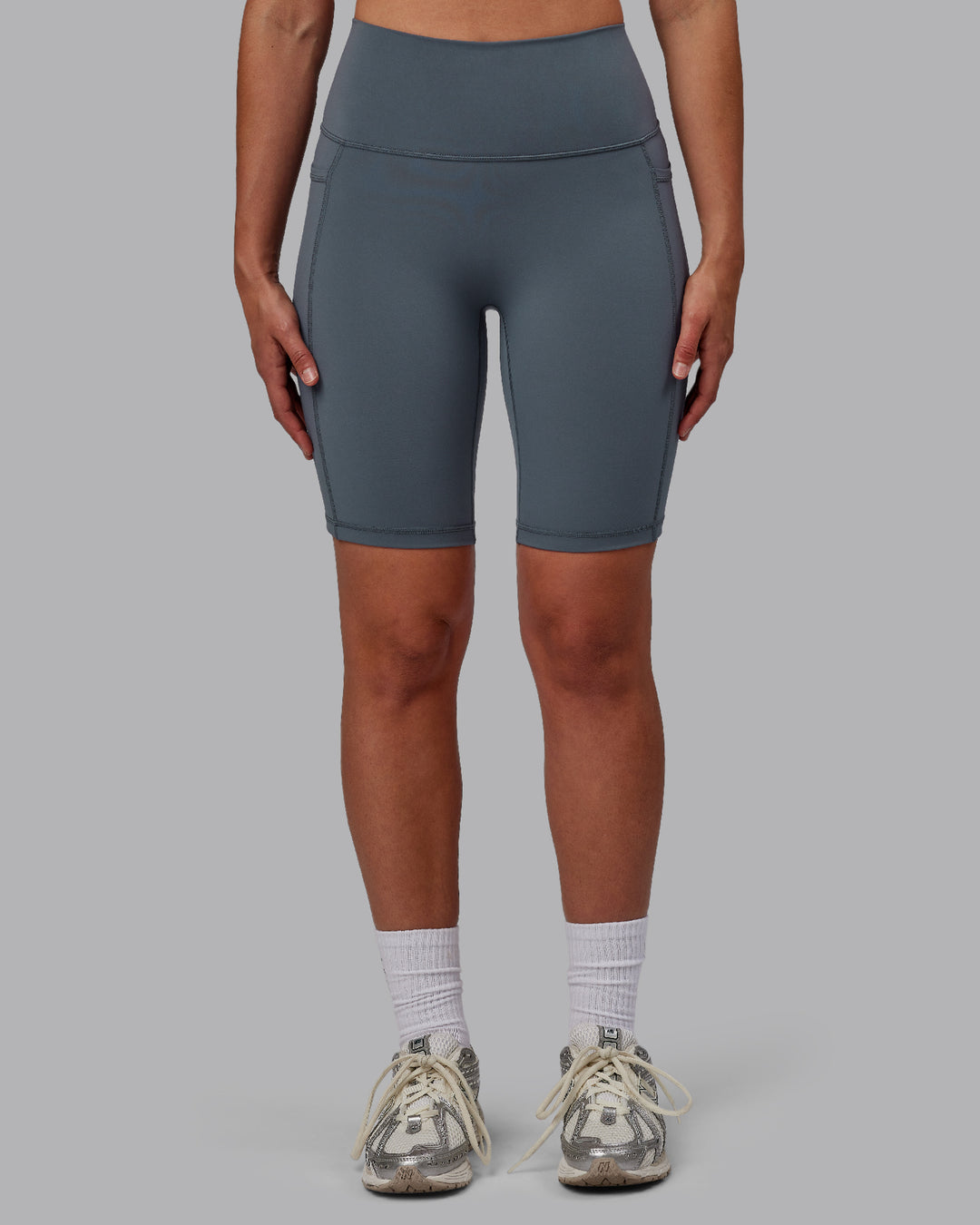 Woman wearing Fusion Ultra High-Rise 9&quot; Short Pockets - Turbulence | Model:Sophie | Size:S