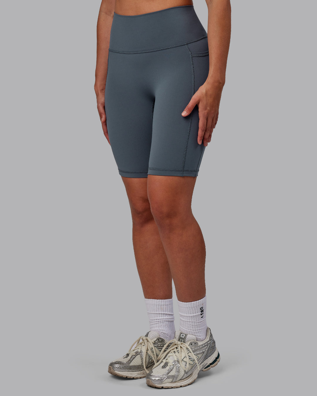 Woman wearing Fusion Ultra High-Rise 9&quot; Short Pockets - Turbulence | Model:Sophie | Size:S