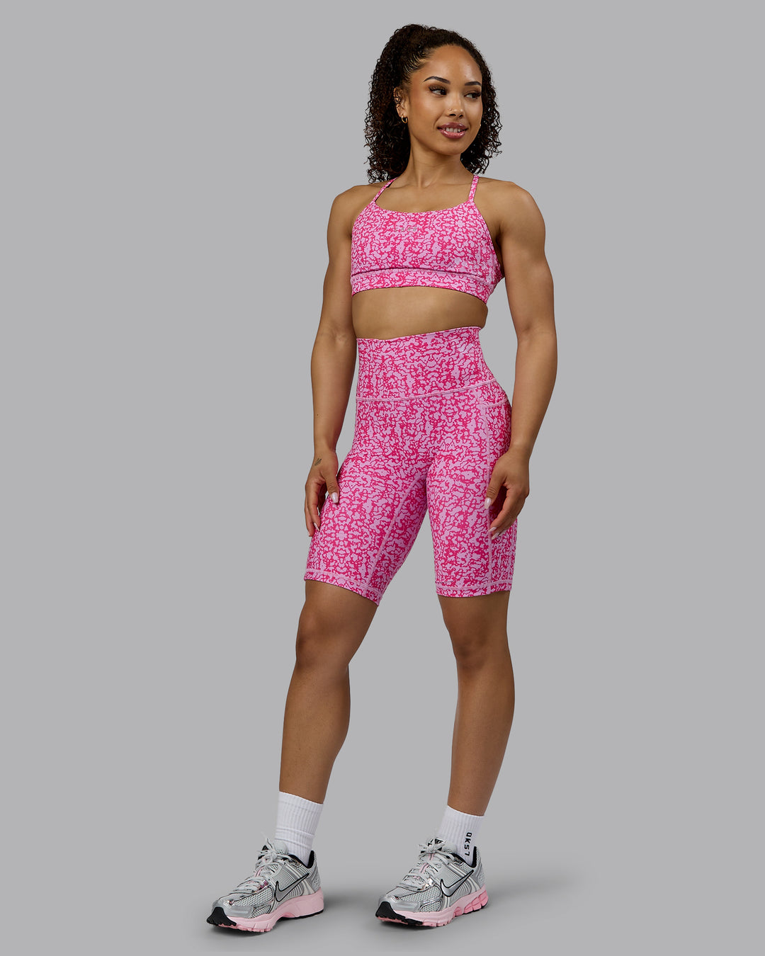 Woman wearing Fusion Ultra High-Rise 9&quot; Short Pockets - Patina-Ultra Pink | Model:Tarnie | Size:S