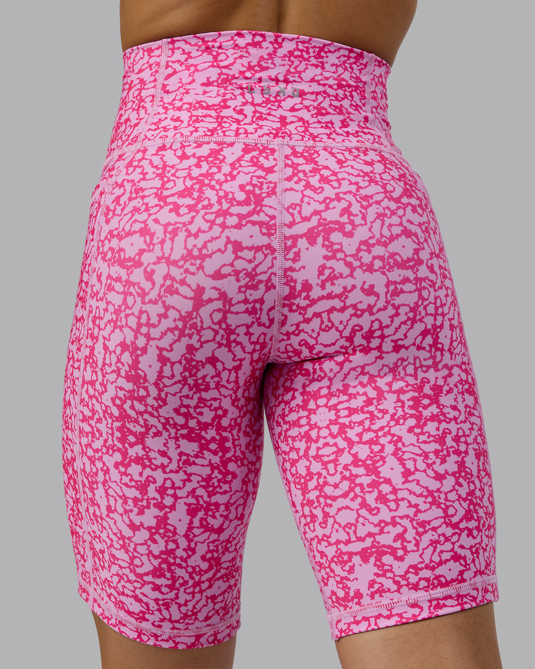 Woman wearing Fusion Ultra High-Rise 9&quot; Short Pockets - Patina-Ultra Pink | Model:Tarnie | Size:S