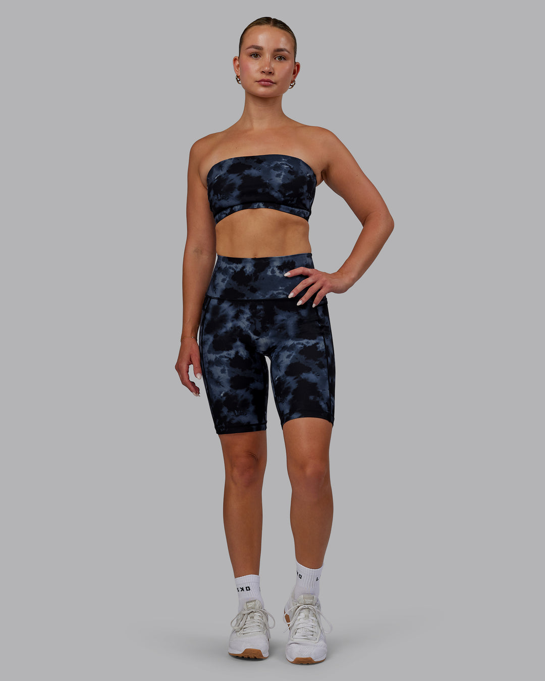 Woman wearing Fusion Ultra High-Rise 9&quot; Short Pockets - Tie Dye-Midnight | Model:Halle | Size:S