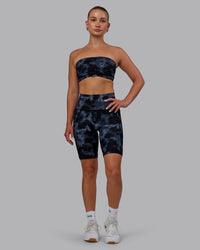 Woman wearing Fusion Ultra High-Rise 9" Short Pockets - Tie Dye-Midnight | Model:Halle | Size:S