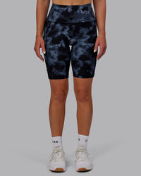 Woman wearing Fusion Ultra High-Rise 9" Short Pockets - Tie Dye-Midnight | Model:Halle | Size:S