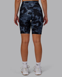 Woman wearing Fusion Ultra High-Rise 9" Short Pockets - Tie Dye-Midnight | Model:Halle | Size:S