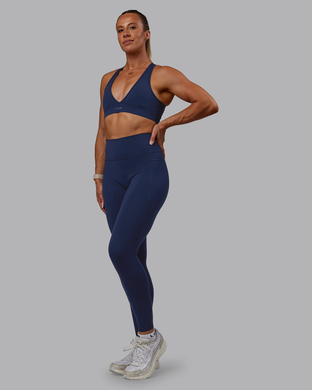 Woman wearing Fusion Ultra High-Rise Full Length Legging Pockets - Future Navy | Model:Bree | Size:S