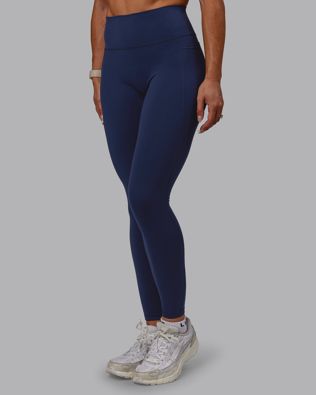 Woman wearing Fusion Ultra High-Rise Full Length Legging Pockets - Future Navy | Model:Bree | Size:S