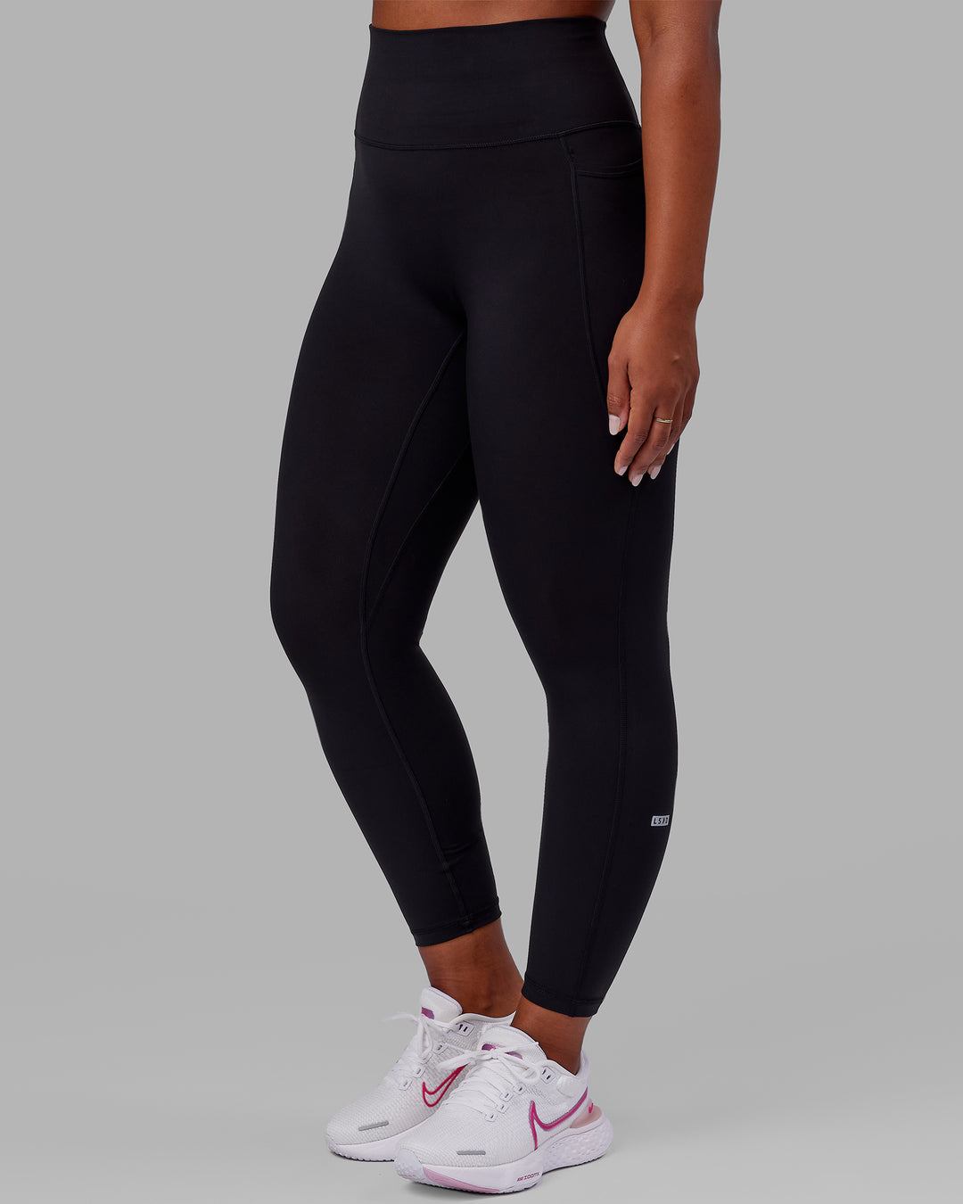 Woman wearing Fusion Ultra High-Rise Full Length Legging Pockets - Black Reflective | Model:Sierra | Size:L
