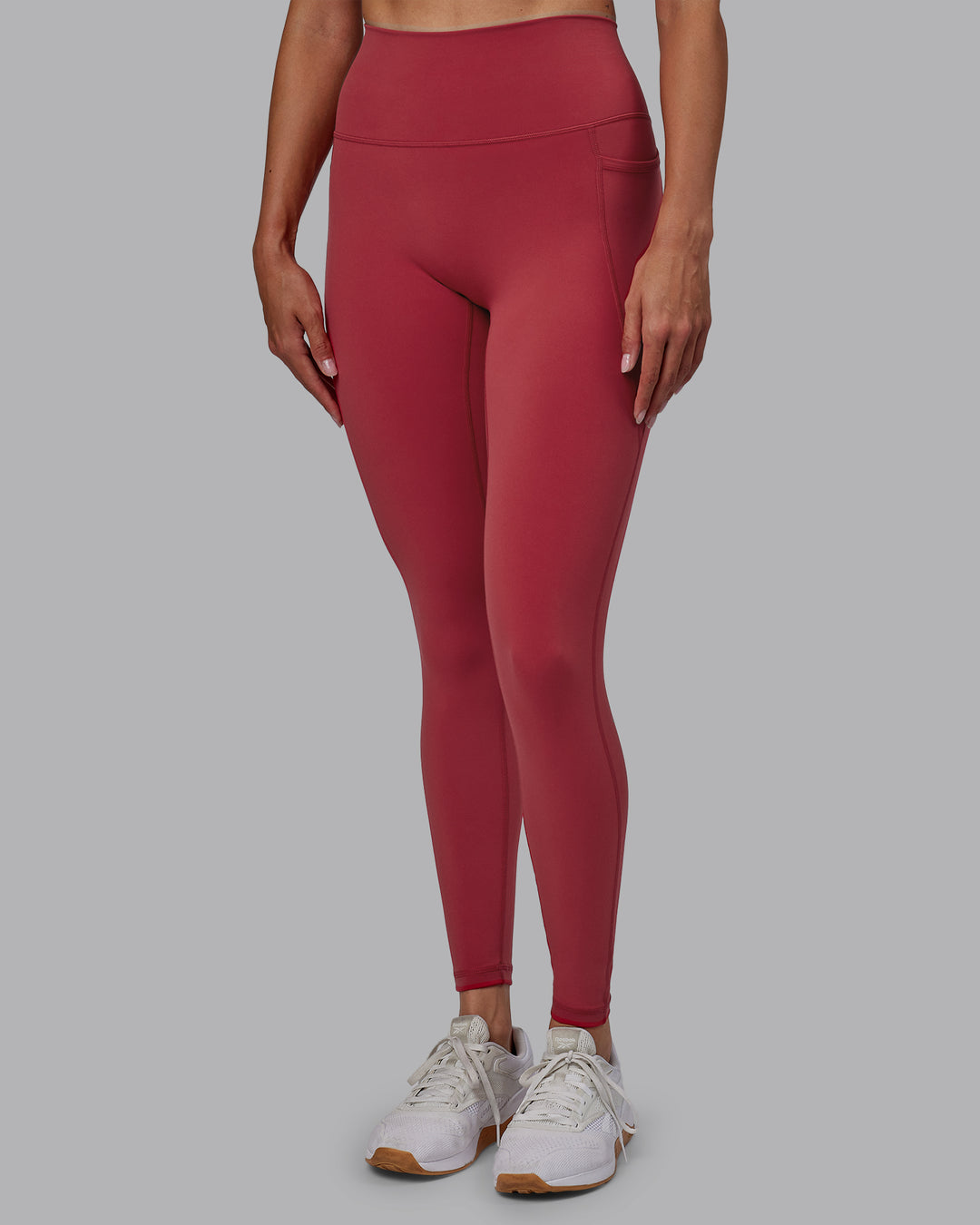 Woman wearing Fusion Ultra High-Rise Full Length Legging Pockets - Claret | Model:Blaize | Size:S