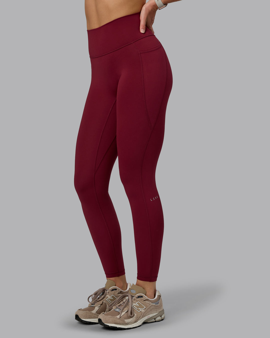 Woman wearing Fusion Ultra High-Rise Full Length Legging Pockets - Cordovan | Model:Chloe | Size:XS