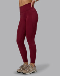 Woman wearing Fusion Ultra High-Rise Full Length Legging Pockets - Cordovan | Model:Chloe | Size:XS