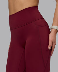 Woman wearing Fusion Ultra High-Rise Full Length Legging Pockets - Cordovan | Model:Chloe | Size:XS