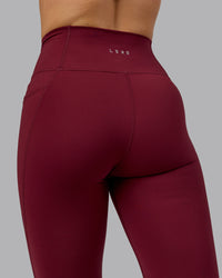 Woman wearing Fusion Ultra High-Rise Full Length Legging Pockets - Cordovan | Model:Chloe | Size:XS
