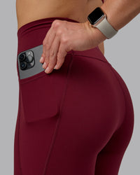 Woman wearing Fusion Ultra High-Rise Full Length Legging Pockets - Cordovan | Model:Chloe | Size:XS