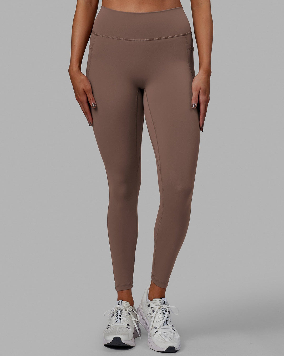 Woman wearing Fusion Ultra High-Rise Full Length Legging Pockets - Deep Taupe | Model:Blaize | Size:S