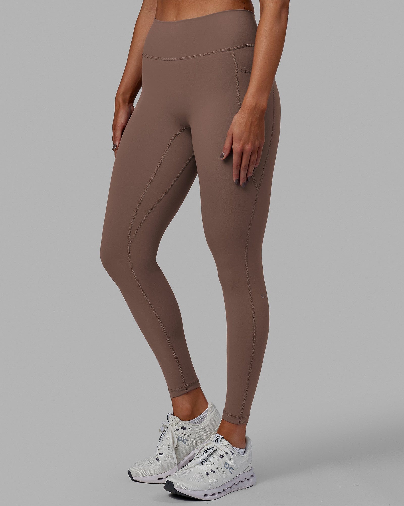 Woman wearing Fusion Ultra High-Rise Full Length Legging Pockets - Deep Taupe | Model:Blaize | Size:S