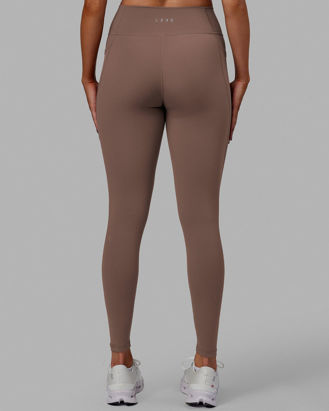 Woman wearing Fusion Ultra High-Rise Full Length Legging Pockets - Deep Taupe | Model:Blaize | Size:S