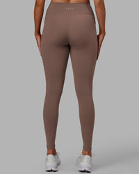 Woman wearing Fusion Ultra High-Rise Full Length Legging Pockets - Deep Taupe | Model:Blaize | Size:S