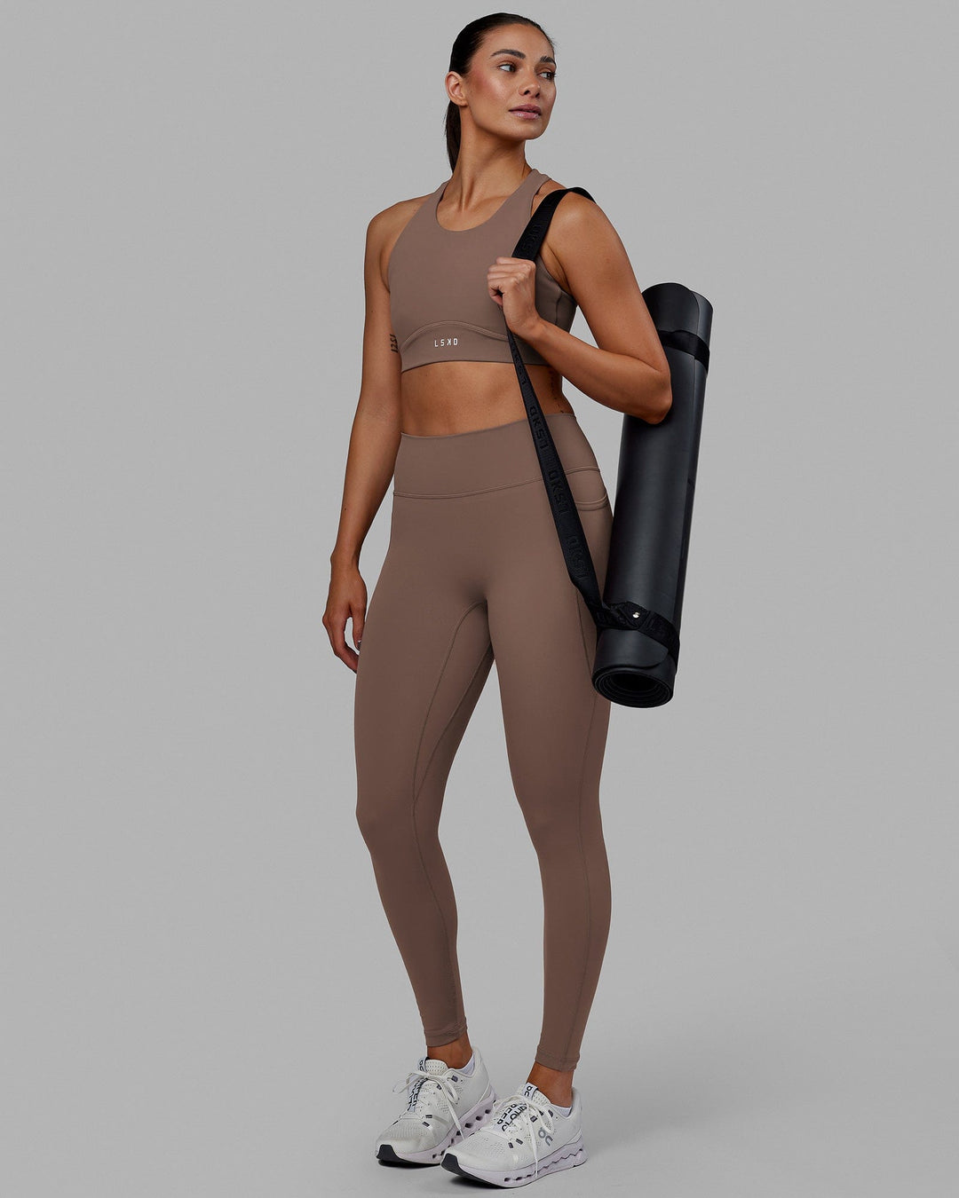 Woman wearing Fusion Ultra High-Rise Full Length Legging Pockets - Deep Taupe | Model:Blaize | Size:S