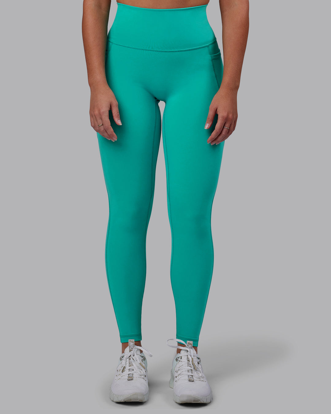 Woman wearing Fusion Ultra High-Rise Full Length Legging Pockets - Turquoise Tide | Model:Hannah | Size:S