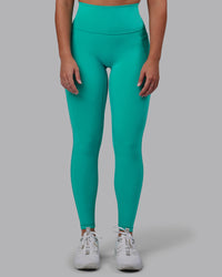 Woman wearing Fusion Ultra High-Rise Full Length Legging Pockets - Turquoise Tide | Model:Hannah | Size:S