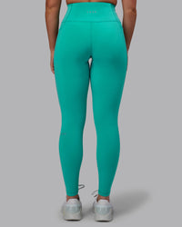 Woman wearing Fusion Ultra High-Rise Full Length Legging Pockets - Turquoise Tide | Model:Hannah | Size:S