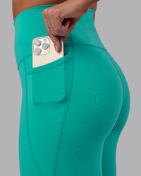 Woman wearing Fusion Ultra High-Rise Full Length Legging Pockets - Turquoise Tide | Model:Hannah | Size:S