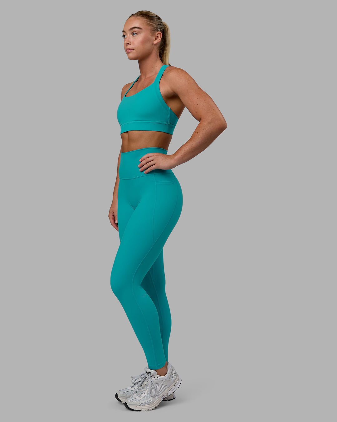 Woman wearing Fusion Ultra High-Rise Full Length Legging Pockets - Uplift Blue | Model:Monique | Size:S