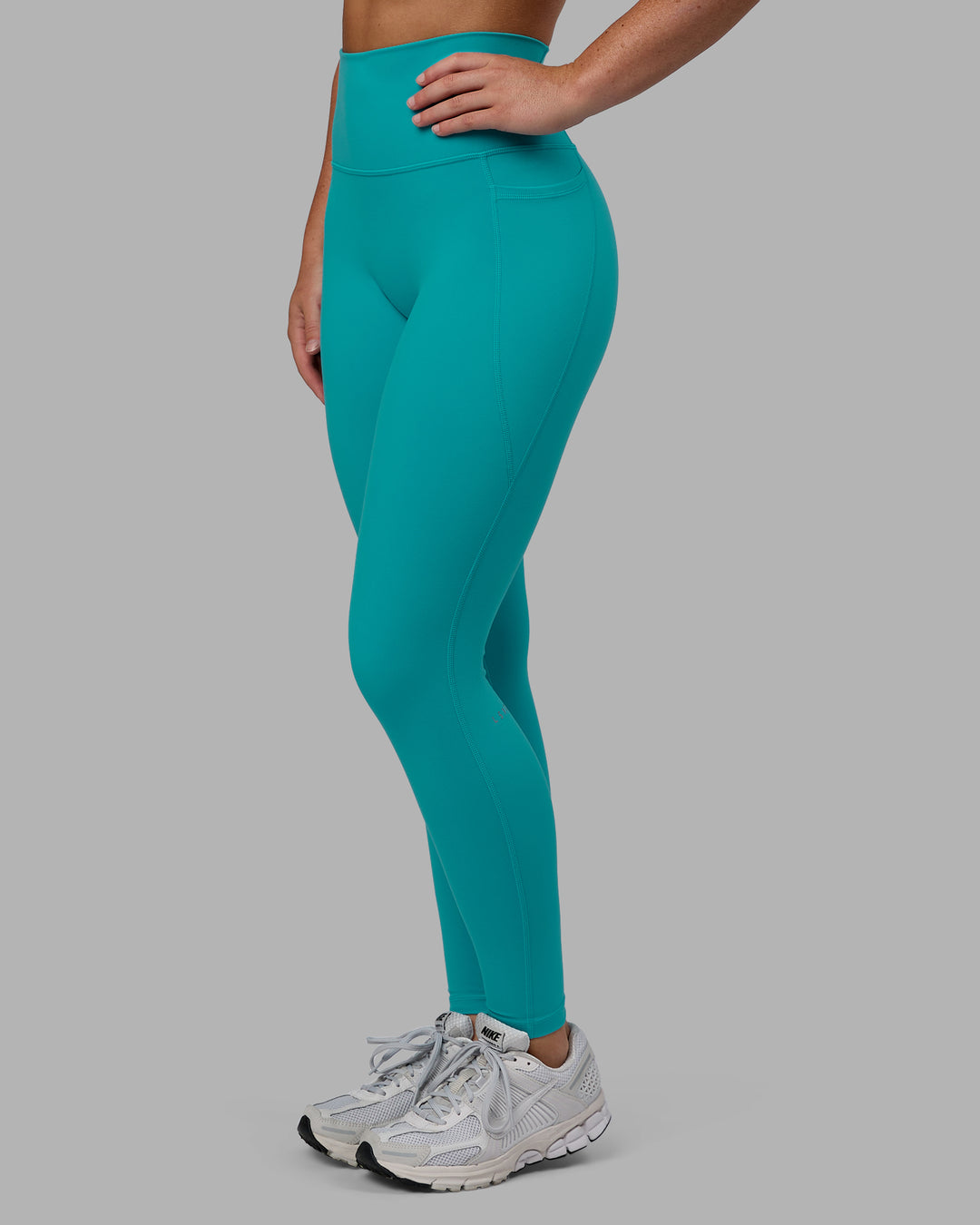 Woman wearing Fusion Ultra High-Rise Full Length Legging Pockets - Uplift Blue | Model:Monique | Size:S
