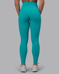Woman wearing Fusion Ultra High-Rise Full Length Legging Pockets - Uplift Blue | Model:Monique | Size:S