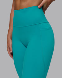 Woman wearing Fusion Ultra High-Rise Full Length Legging Pockets - Uplift Blue | Model:Monique | Size:S