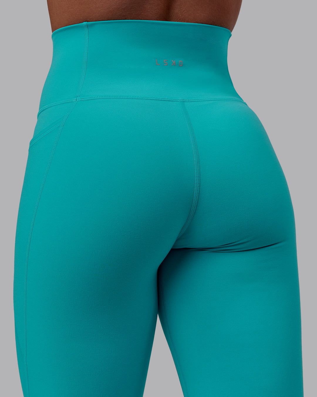 Woman wearing Fusion Ultra High-Rise Full Length Legging Pockets - Uplift Blue | Model:Monique | Size:S