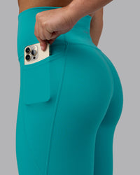Woman wearing Fusion Ultra High-Rise Full Length Legging Pockets - Uplift Blue | Model:Monique | Size:S
