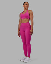 Woman wearing Fusion Ultra High-Rise Full Length Legging Pockets - Fuchsia Pink | Model:Sophie | Size:S