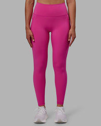 Woman wearing Fusion Ultra High-Rise Full Length Legging Pockets - Fuchsia Pink | Model:Sophie | Size:S