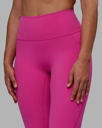 Woman wearing Fusion Ultra High-Rise Full Length Legging Pockets - Fuchsia Pink | Model:Sophie | Size:S