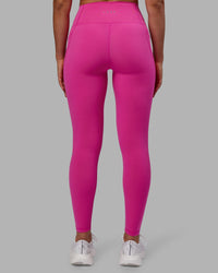 Woman wearing Fusion Ultra High-Rise Full Length Legging Pockets - Fuchsia Pink | Model:Sophie | Size:S