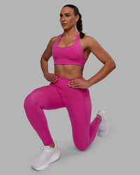 Woman wearing Fusion Ultra High-Rise Full Length Legging Pockets - Fuchsia Pink | Model:Sophie | Size:S