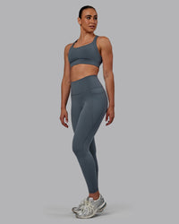 Woman wearing Fusion Ultra High-Rise Full Length Legging Pockets - Turbulence | Model:Sophie | Size:S