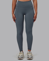 Woman wearing Fusion Ultra High-Rise Full Length Legging Pockets - Turbulence | Model:Sophie | Size:S