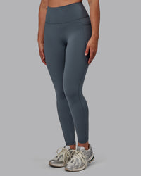 Woman wearing Fusion Ultra High-Rise Full Length Legging Pockets - Turbulence | Model:Sophie | Size:S