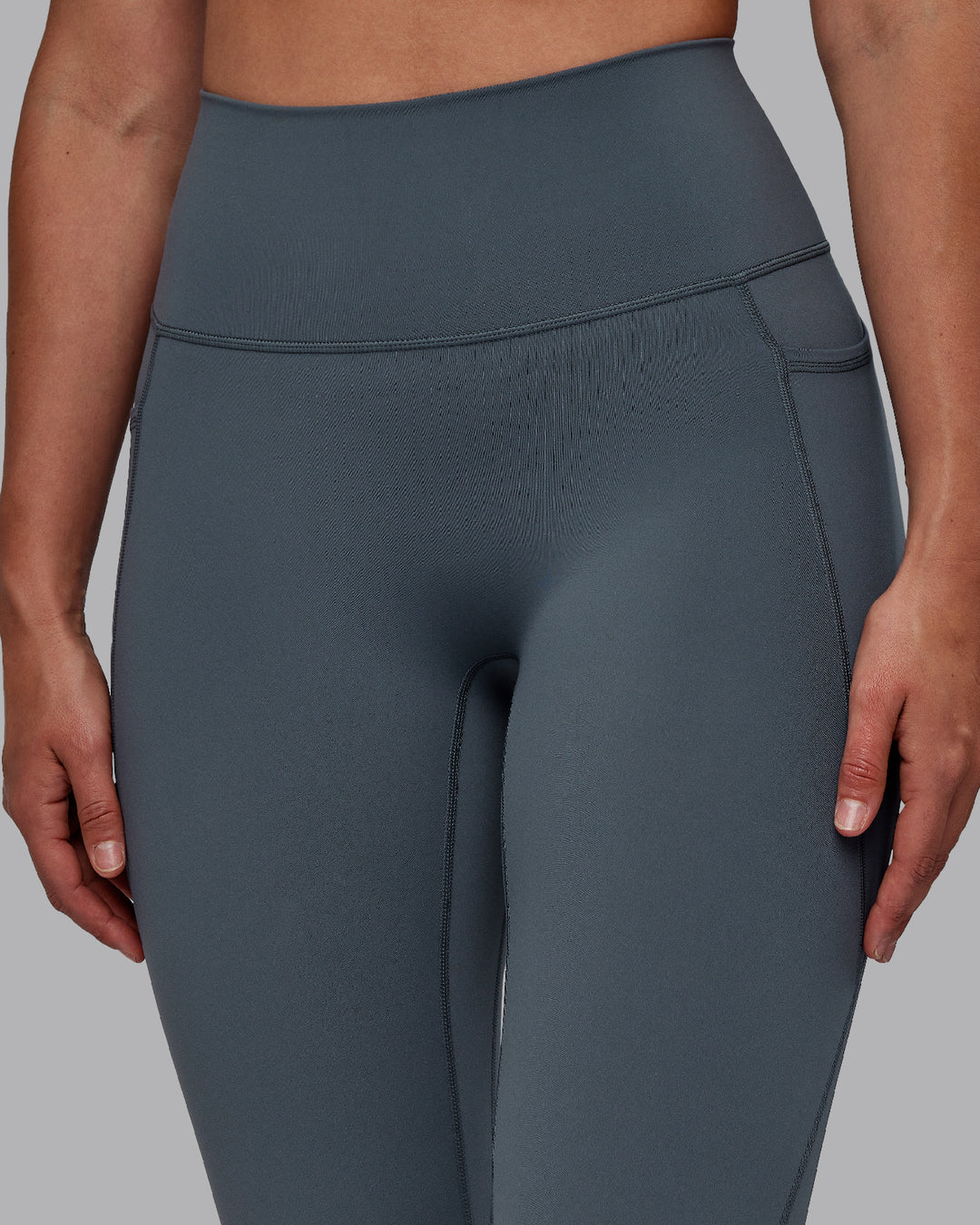 Woman wearing Fusion Ultra High-Rise Full Length Legging Pockets - Turbulence | Model:Sophie | Size:S