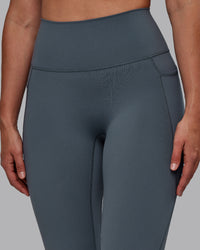 Woman wearing Fusion Ultra High-Rise Full Length Legging Pockets - Turbulence | Model:Sophie | Size:S