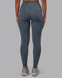 Woman wearing Fusion Ultra High-Rise Full Length Legging Pockets - Turbulence | Model:Sophie | Size:S