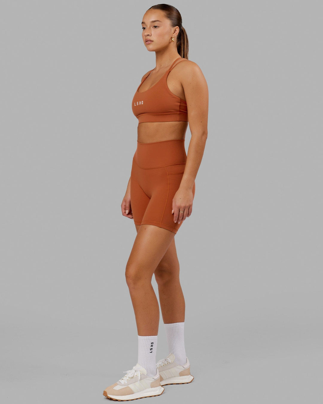 Model wearing Fusion Mid Short Tight - Auburn