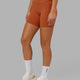 Model wearing Fusion Mid Short Tight - Auburn